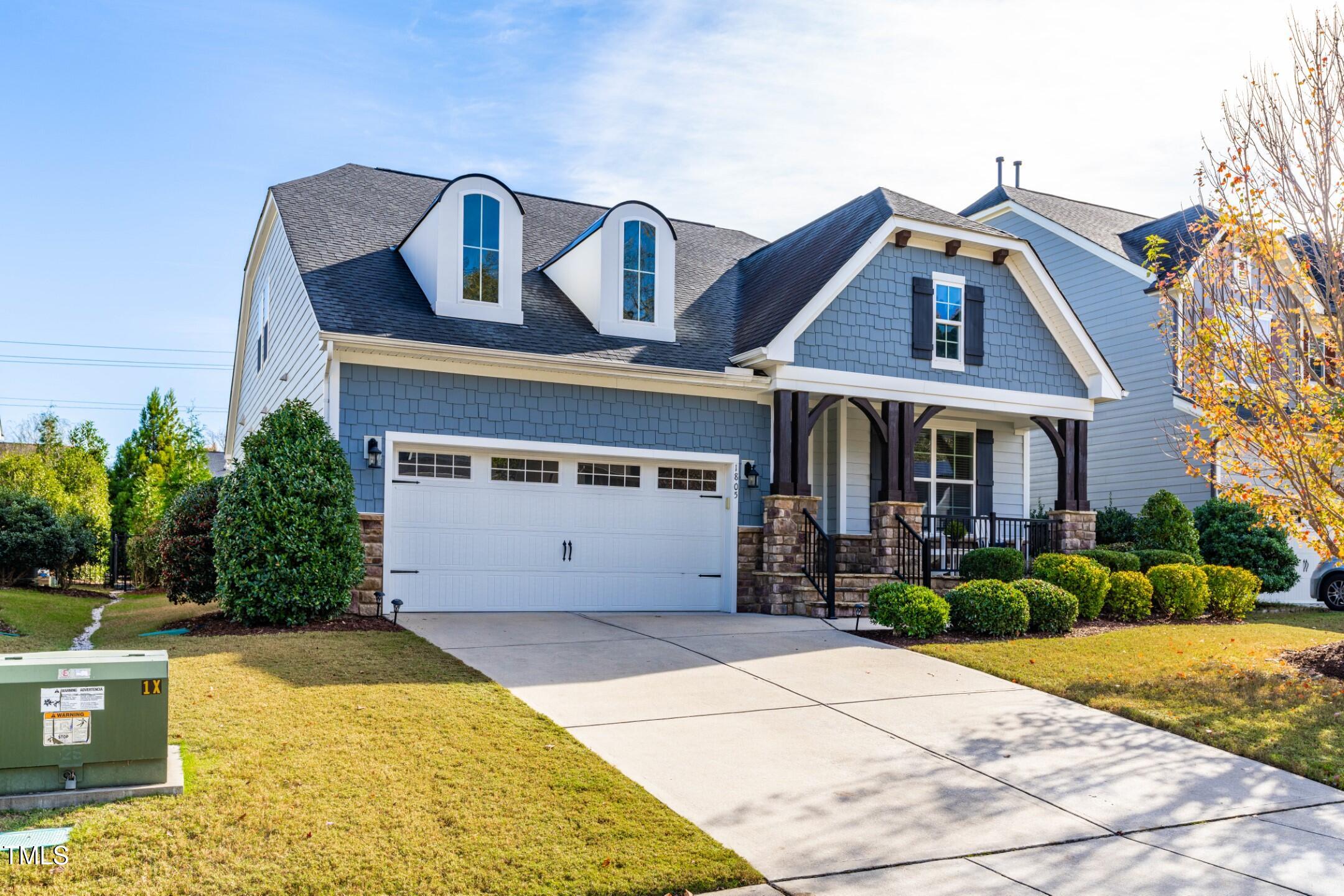 1805 Bodwin Lane Apex, NC 27502 - Photo 36 of 43 a front view of a house with garden