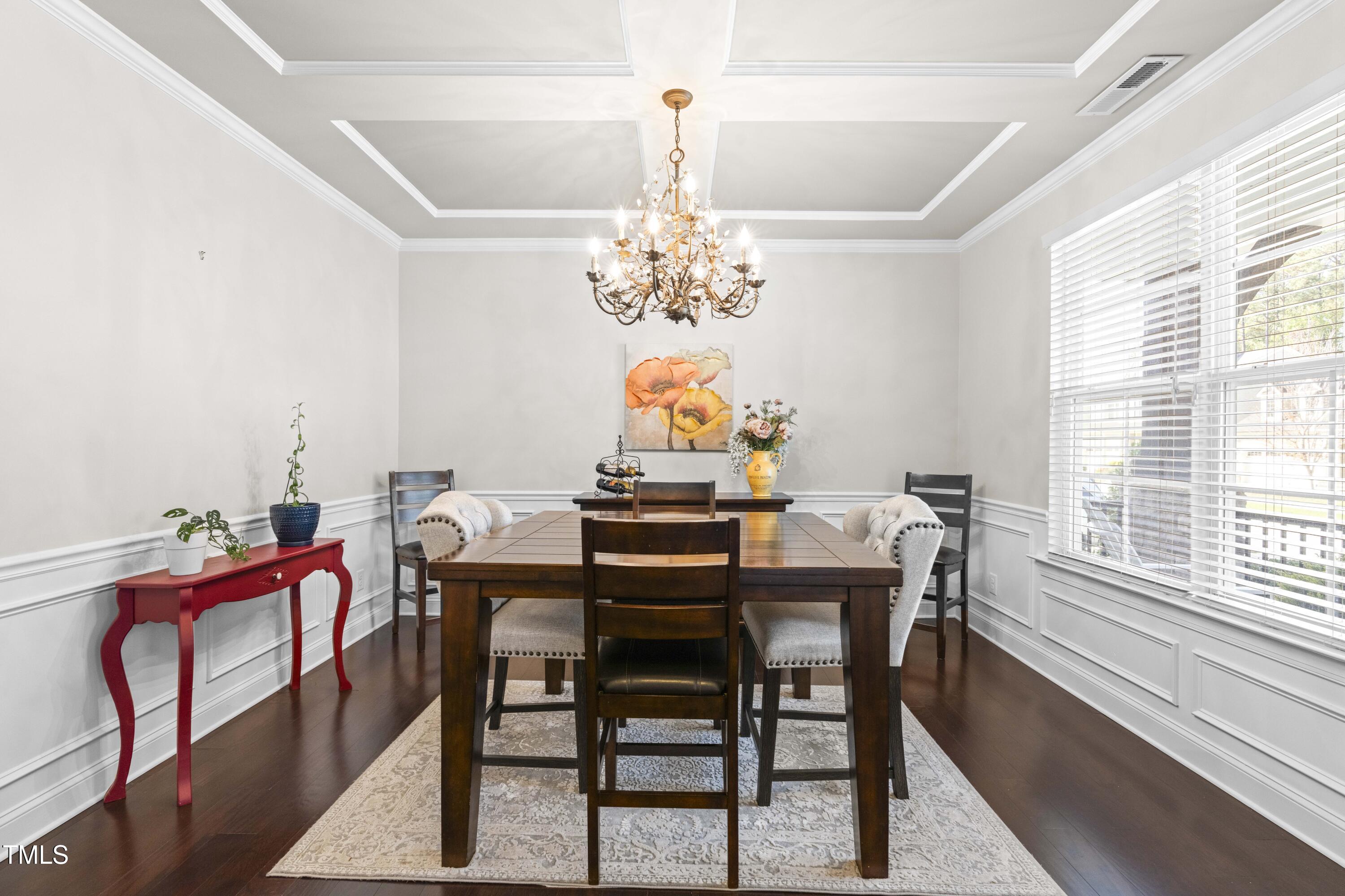 1805 Bodwin Lane Apex, NC 27502 - Photo 5 of 43 a view of a dining room with furniture a chandelier and a window