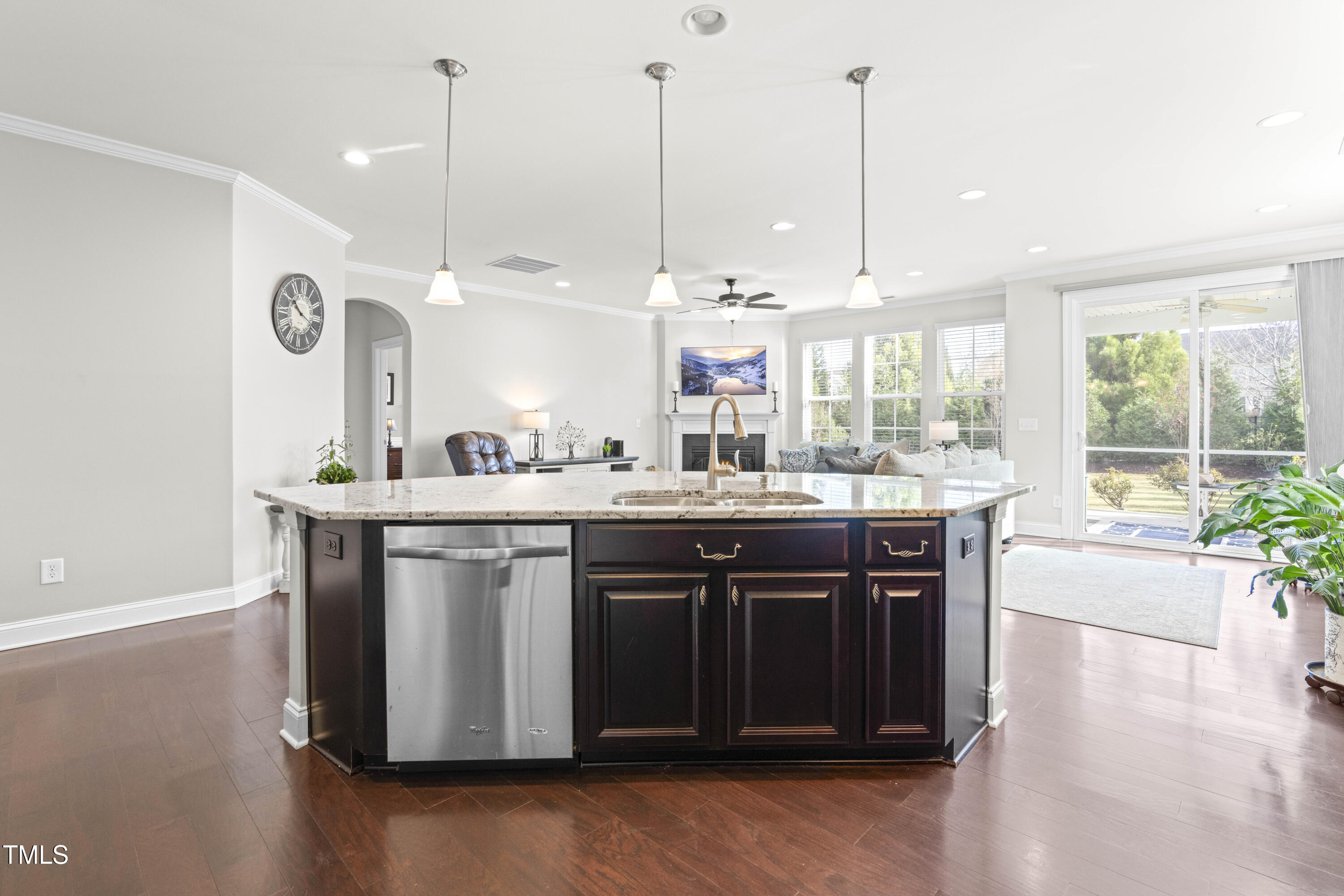 1805 Bodwin Lane Apex, NC 27502 - Photo 9 of 43 a kitchen with stainless steel appliances granite countertop a sink a stove and a wooden floors