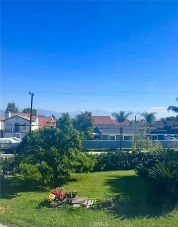 a view of a garden with a house