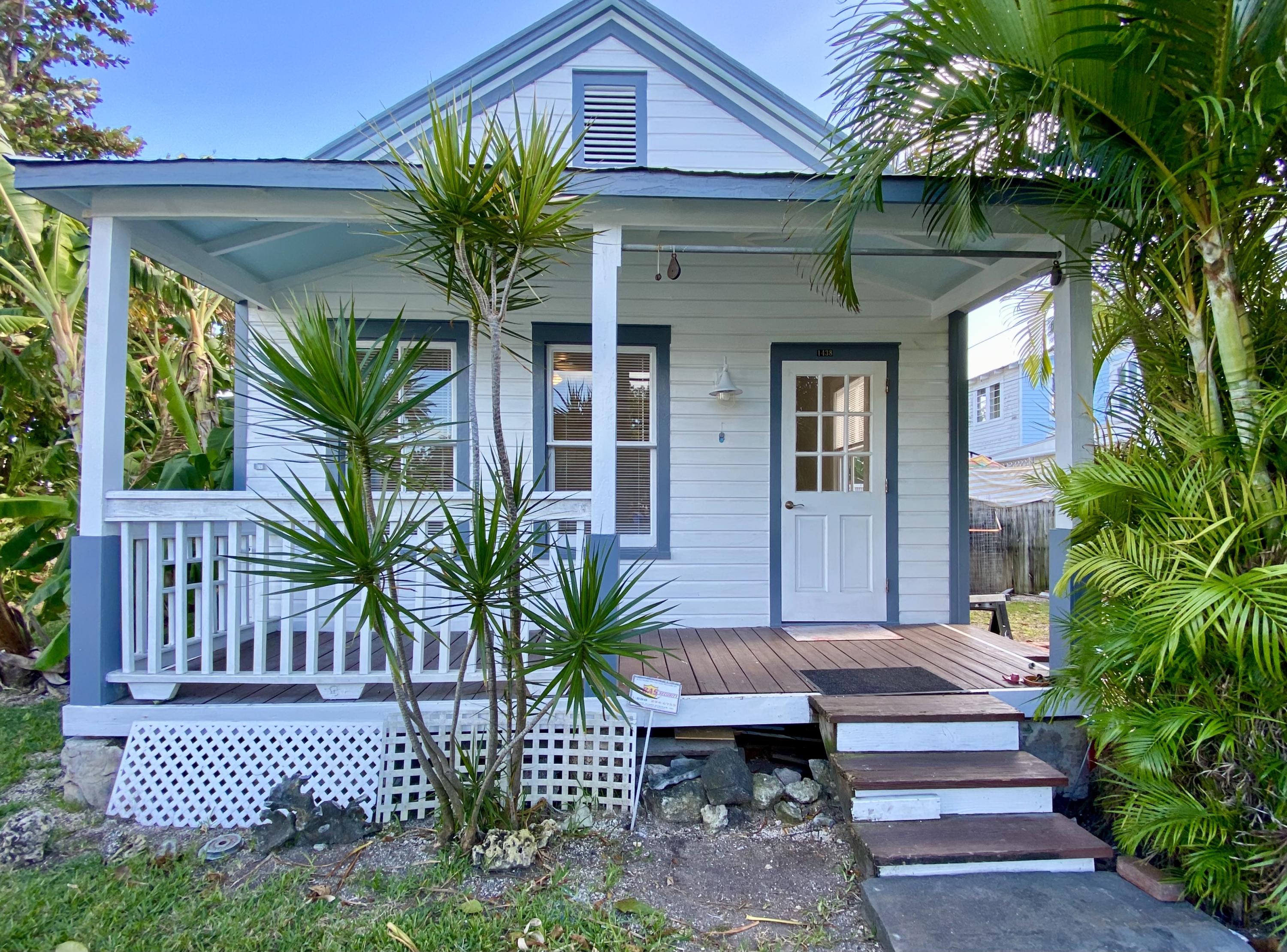 1438 Virginia Street Key West, FL 33040 - Photo 2 of 37 a view of a house with a flower garden