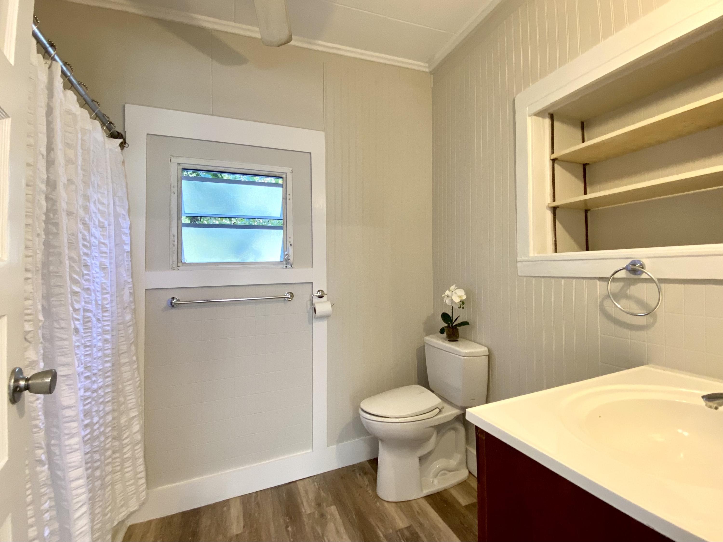 1438 Virginia Street Key West, FL 33040 - Photo 11 of 37 a white toilet sitting next to a bathroom sink