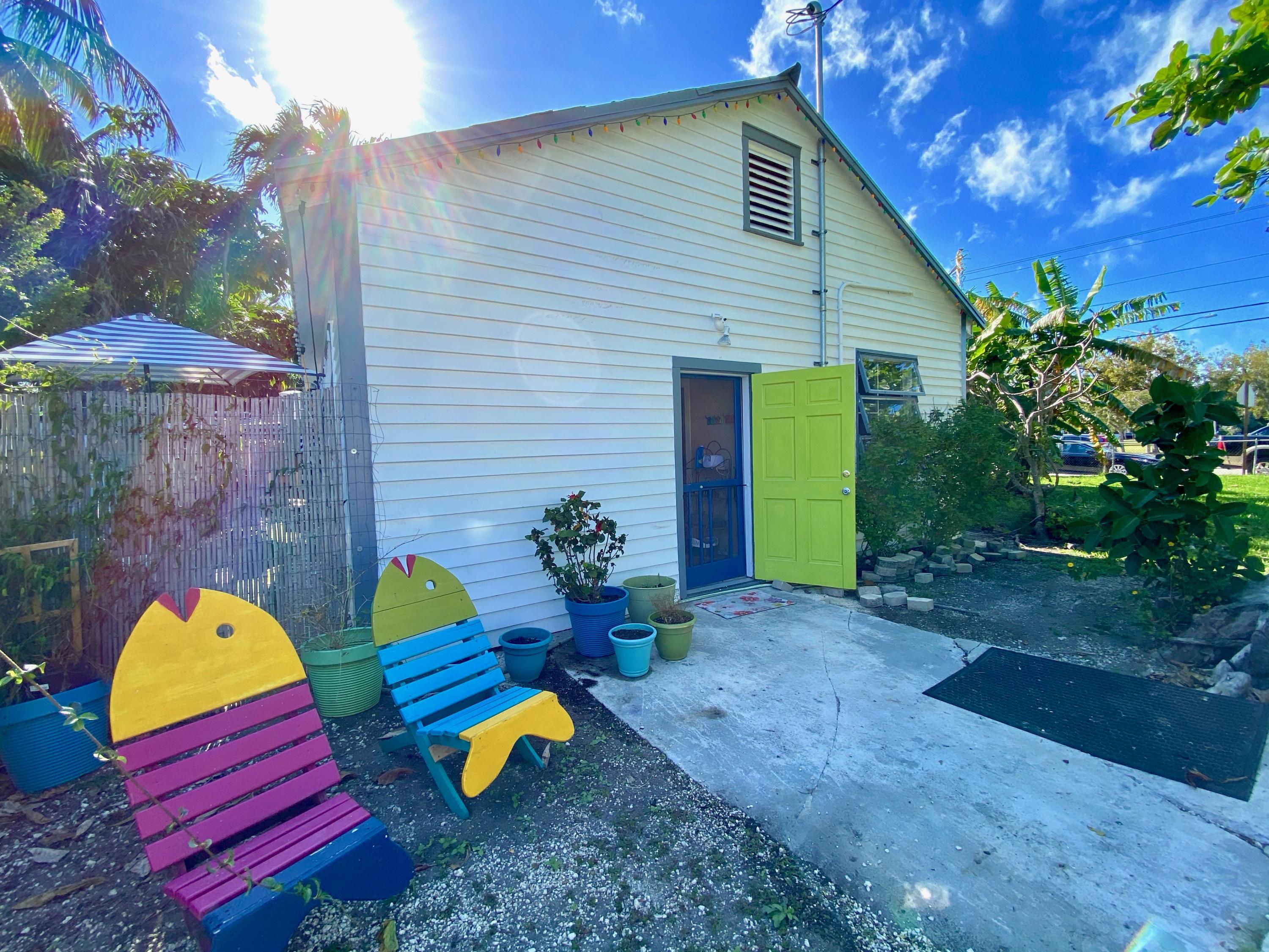 1438 Virginia Street Key West, FL 33040 - Photo 14 of 37 a view of a house with a backyard