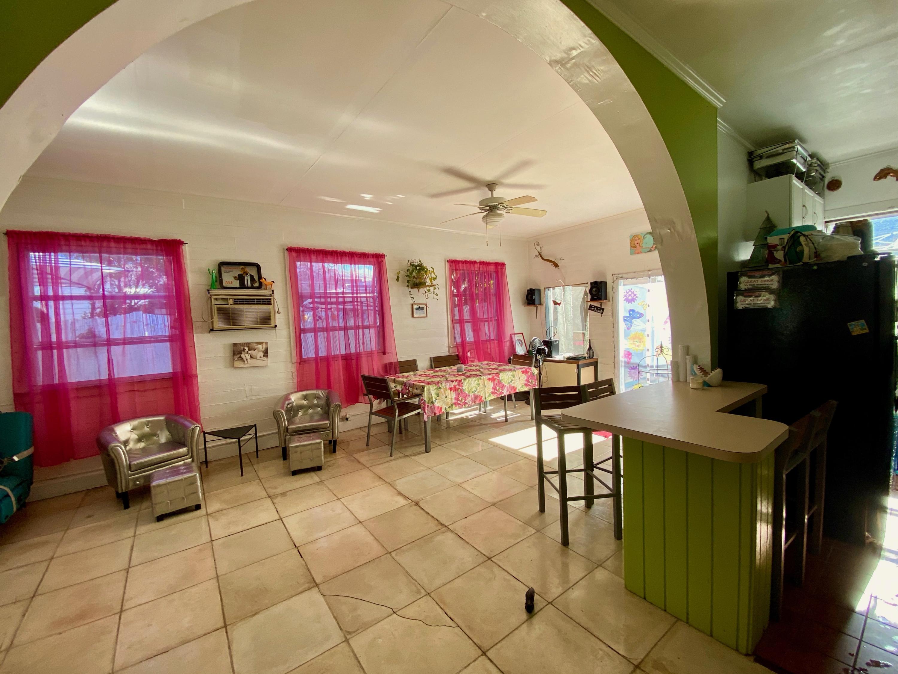 1438 Virginia Street Key West, FL 33040 - Photo 18 of 37 a view of a livingroom with furniture and window