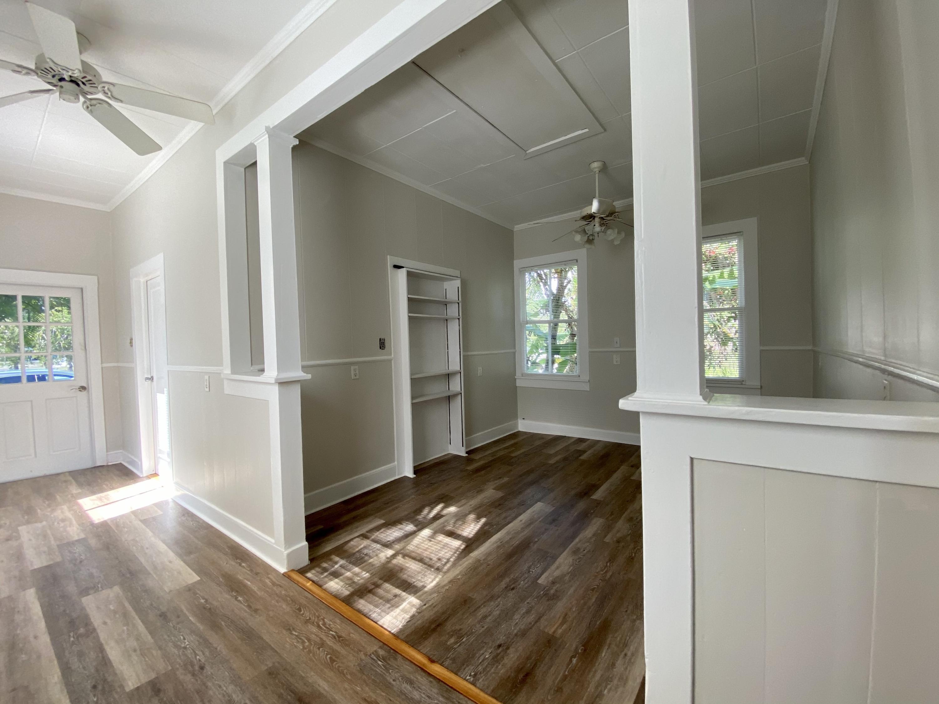 1438 Virginia Street Key West, FL 33040 - Photo 4 of 37 a view of kitchen with cabinets and wooden floor