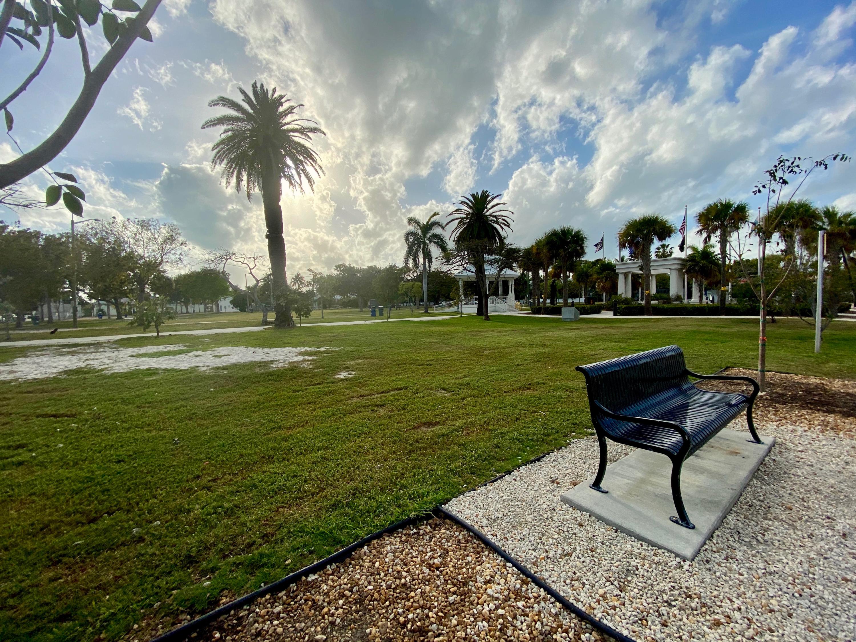 1438 Virginia Street Key West, FL 33040 - Photo 34 of 37 a garden with a bench and trees