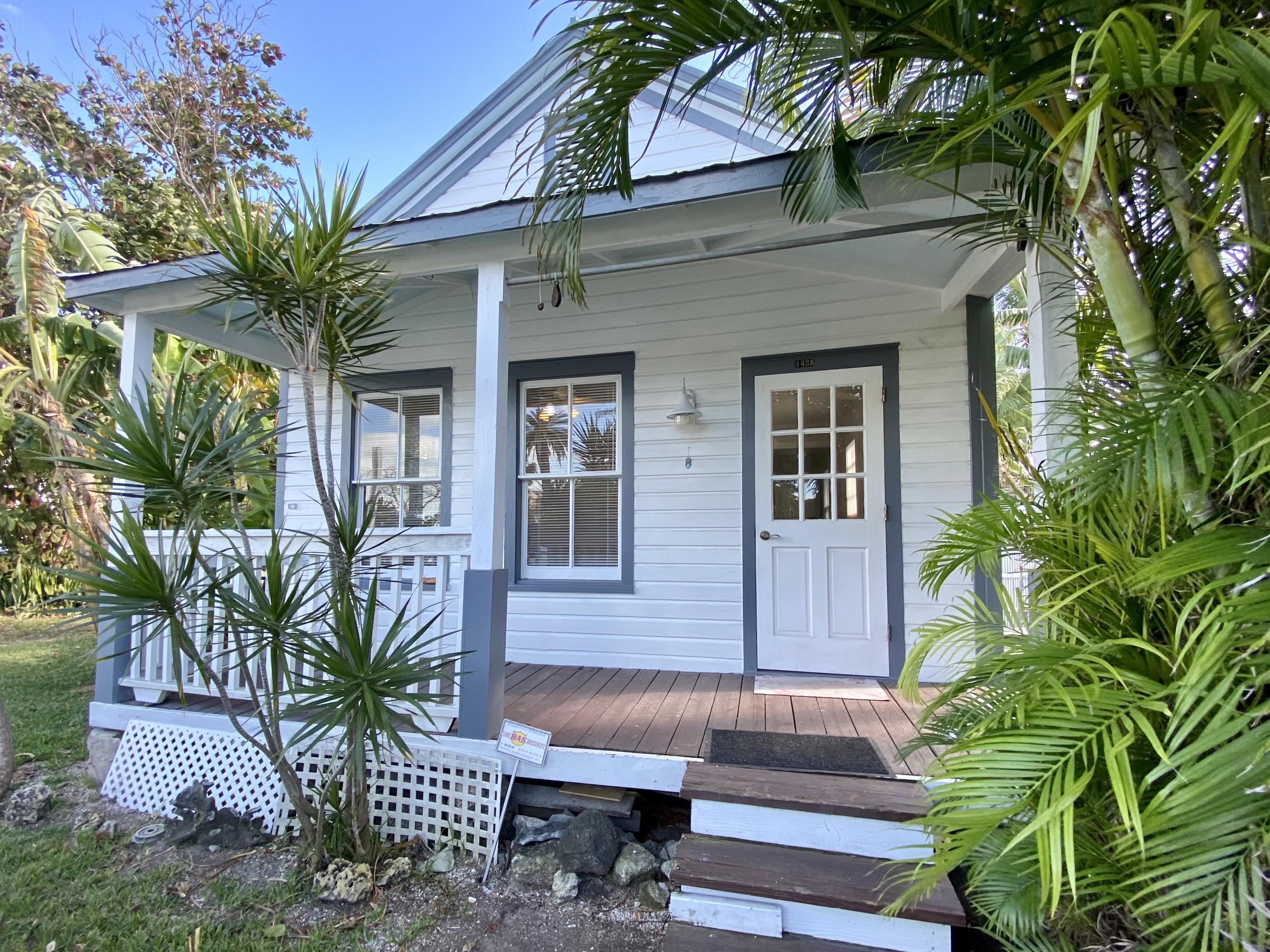 1438 Virginia Street Key West, FL 33040 - Photo 37 of 37 a front view of a house with a yard