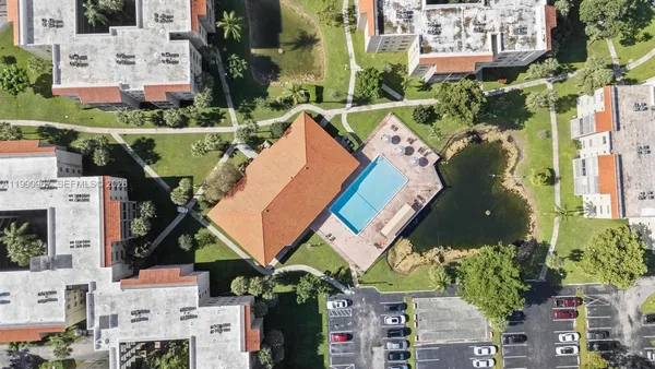 an aerial view of multiple houses with yard