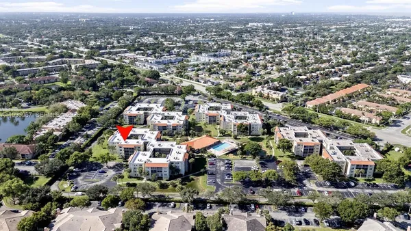 an aerial view of residential houses with city view