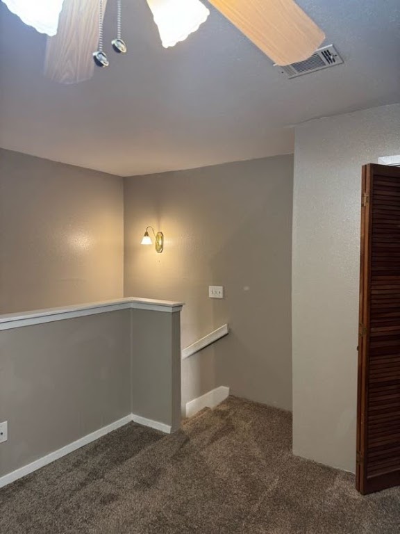 1305 West Villa Maria Road, Unit F105 Bryan, TX 77801 - Photo 13 of 26 Staircase featuring carpet flooring