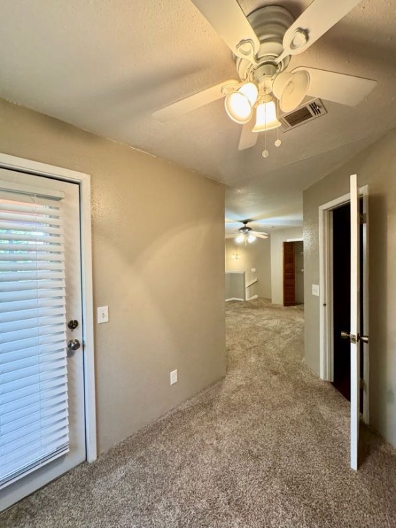 1305 West Villa Maria Road, Unit F105 Bryan, TX 77801 - Photo 19 of 26 Hall with carpet floors and a textured ceiling