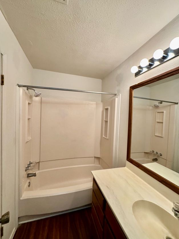 1305 West Villa Maria Road, Unit F105 Bryan, TX 77801 - Photo 22 of 26 a bathroom with a tub sink and mirror