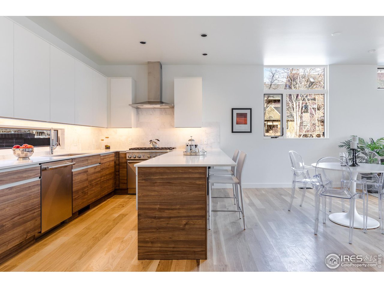 2304 Pearl Street, Unit 2 Boulder, CO 80302 - Photo 7 of 16 a kitchen with granite countertop a sink cabinets and window