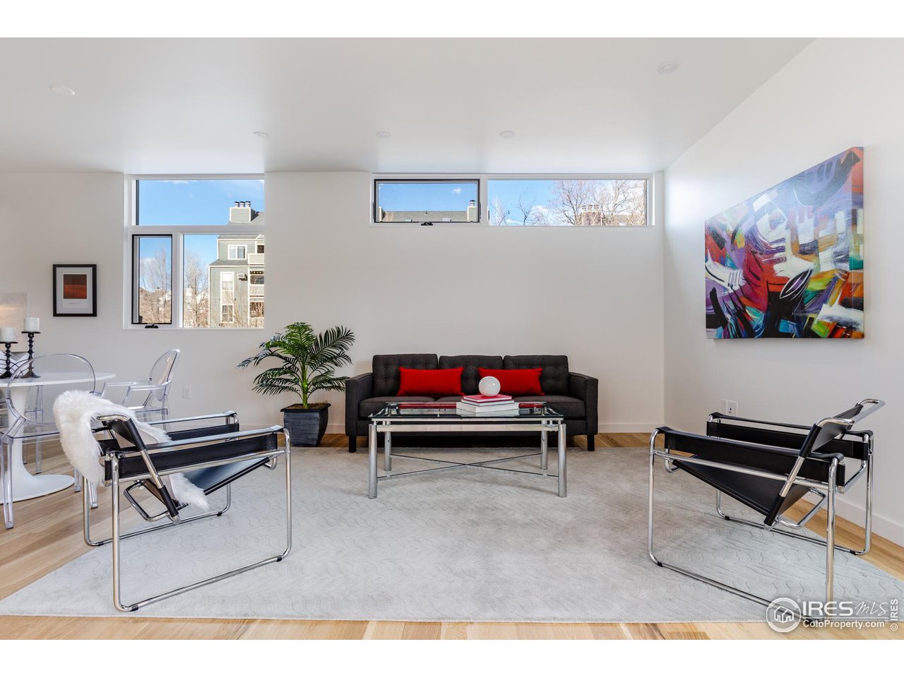 2304 Pearl Street, Unit 2 Boulder, CO 80302 - Photo 9 of 16 a living room with furniture and a bookshelf