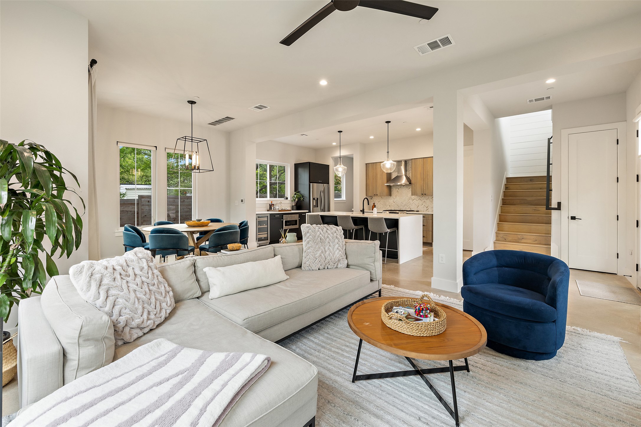 1504 Ruth Avenue, Unit 3 Austin, TX 78757 - Photo 6 of 39 An open concept living area seamlessly connects to a modern kitchen and dining space, ideal for gatherings.
