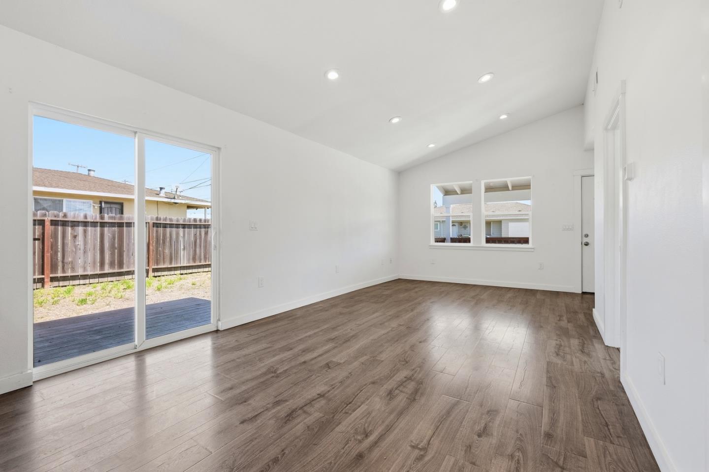 16 Airport Road Freedom, CA 95019 - Photo 9 of 37 an empty room with wooden floor and windows