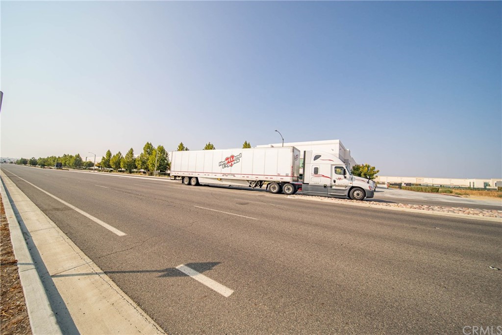 22 Harley Knox Boulevard Perris, CA 92571 - Photo 6 of 35 a view of a city street with a road