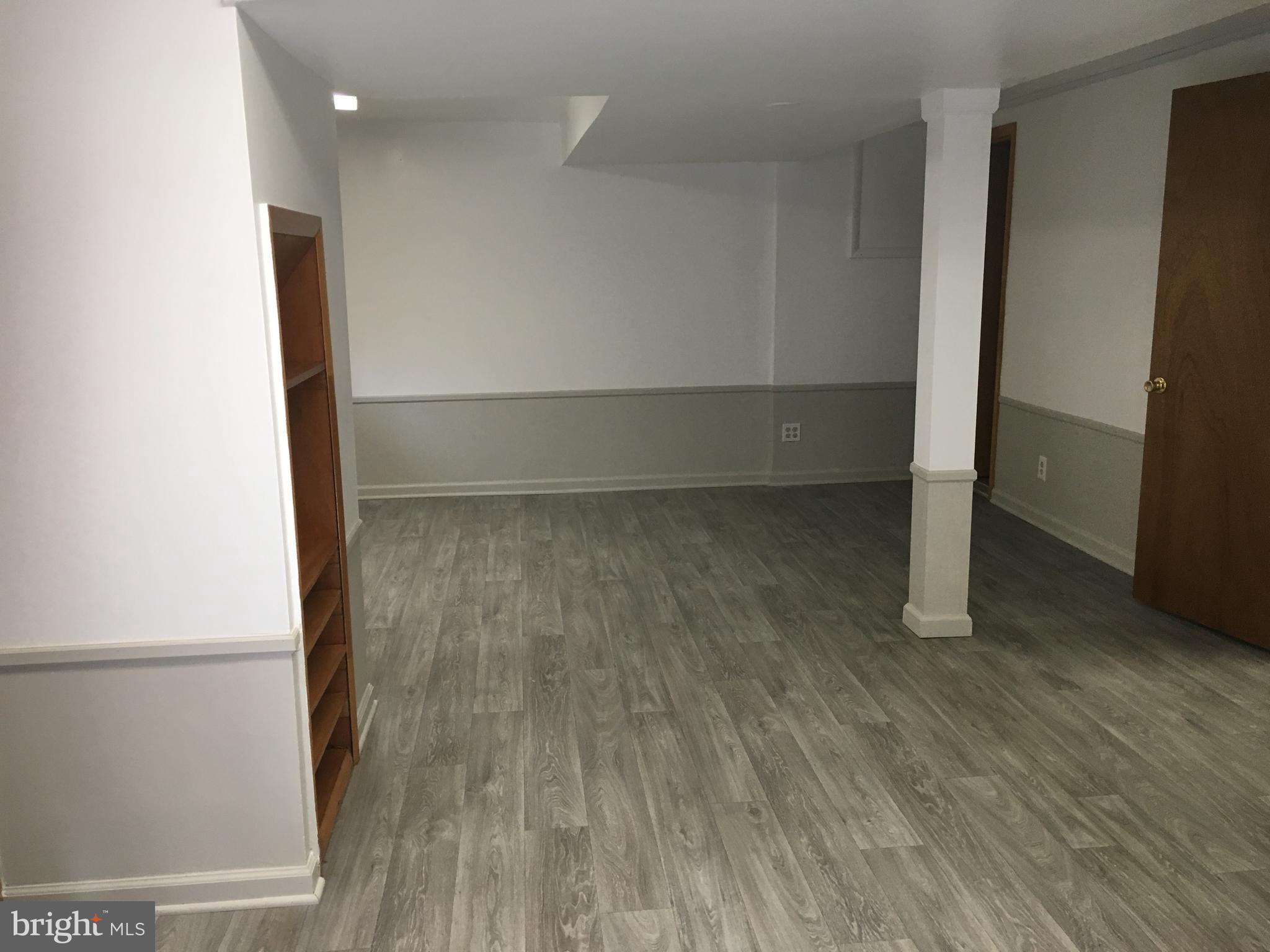 5700 Forest Place Bethesda, MD 20814 - Photo 13 of 20 Lower level family room