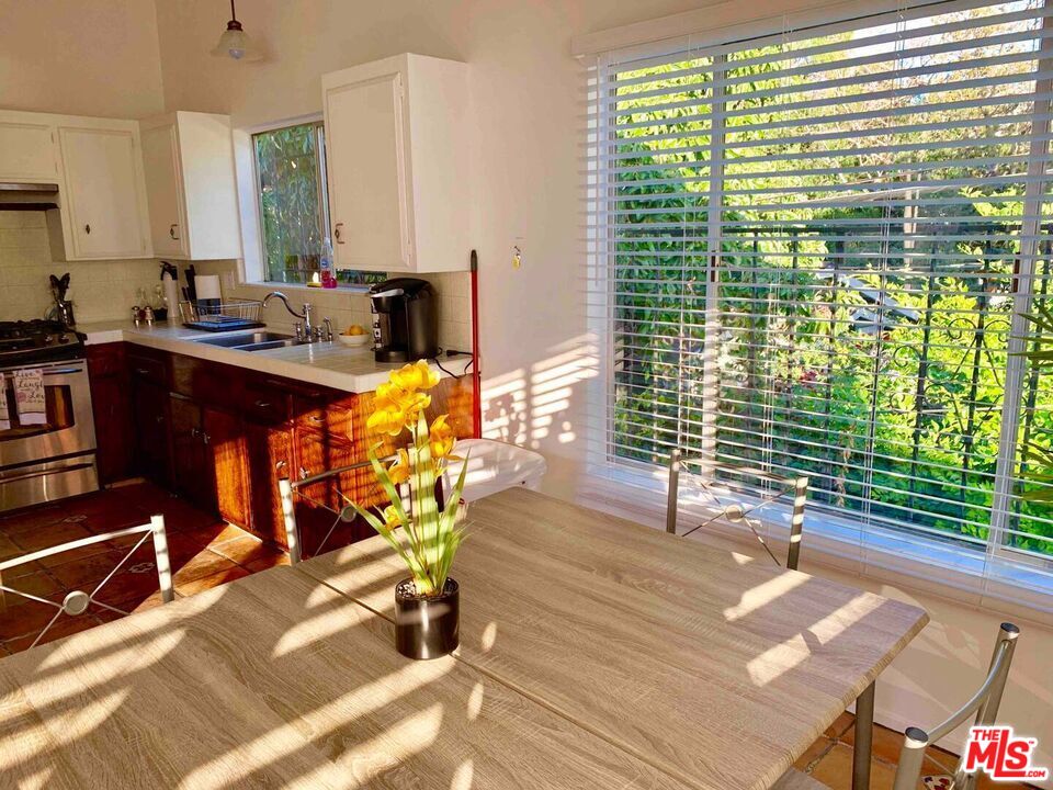 1152 1/2 North Ogden Drive West Hollywood, CA 90046 - Photo 4 of 12 a living room with patio furniture