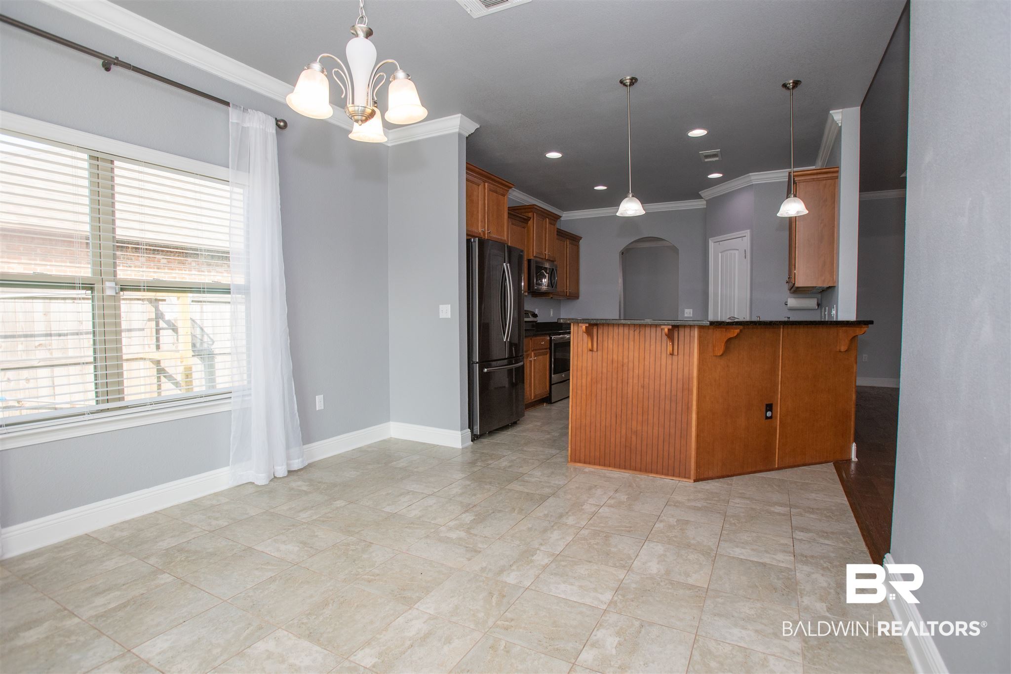 7029 Rocky Rd Loop Gulf Shores, AL 36542 - Photo 15 of 43 breakfast room to kitchen