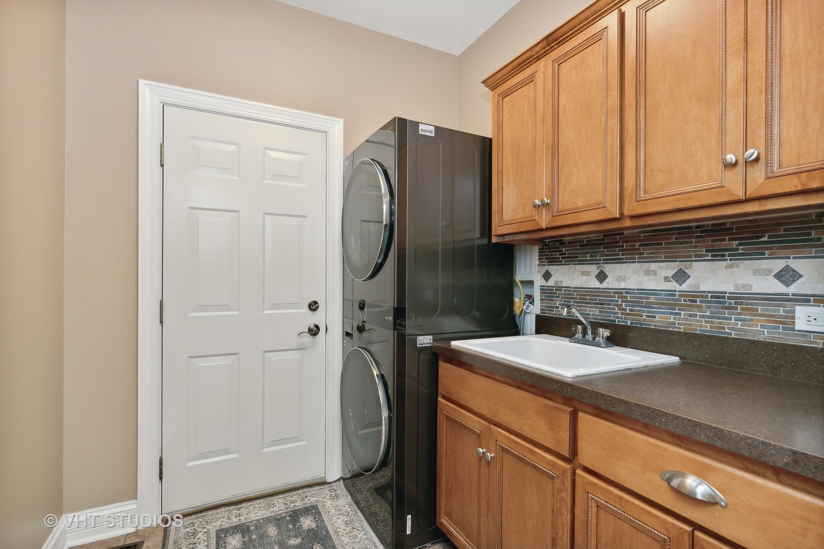 8902 Voss Road Marengo, IL 60152 - Photo 19 of 35 a kitchen with a refrigerator sink and cabinets