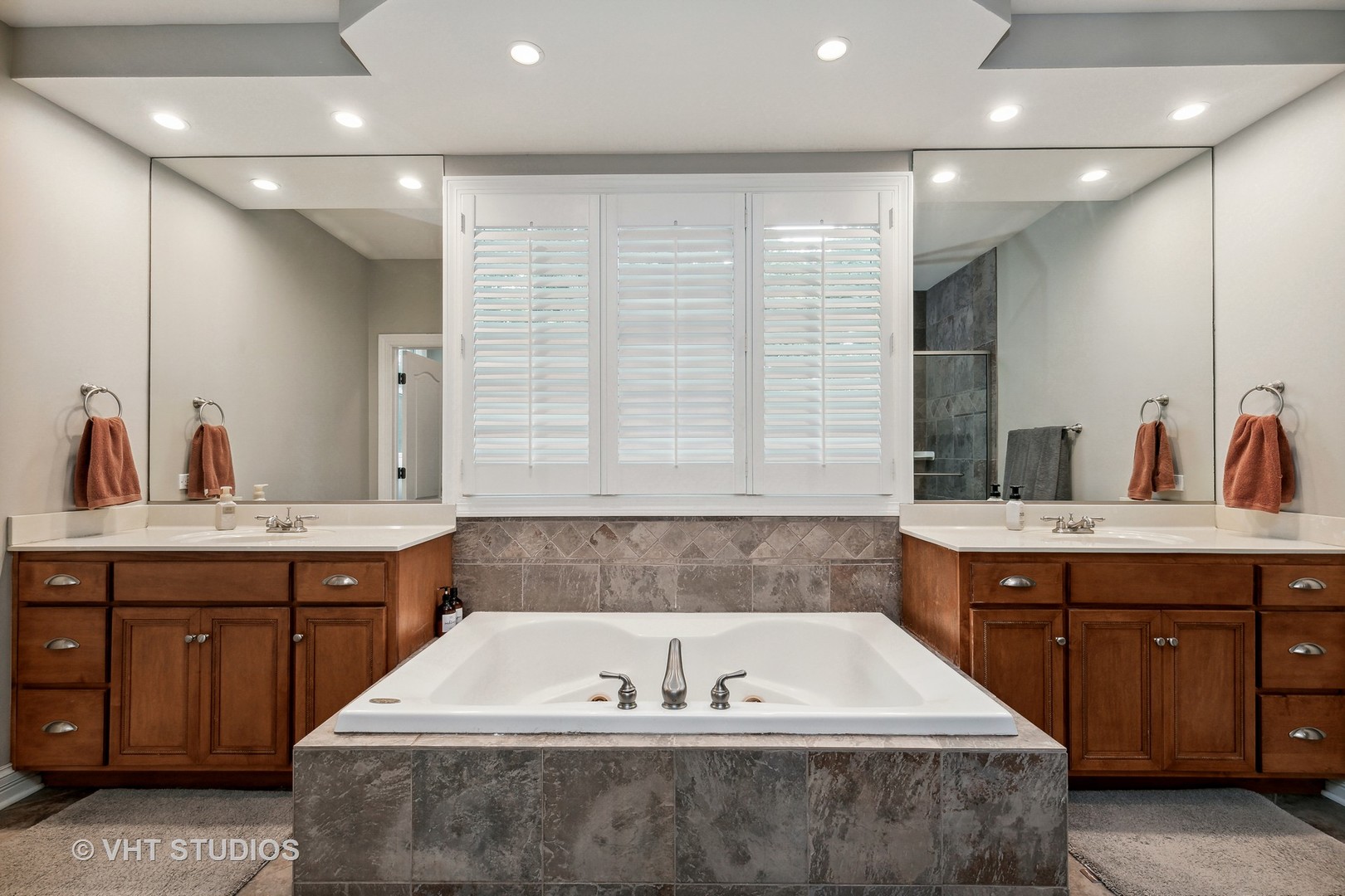 8902 Voss Road Marengo, IL 60152 - Photo 22 of 35 a spacious bathroom with a bathtub a double vanity sink and mirror