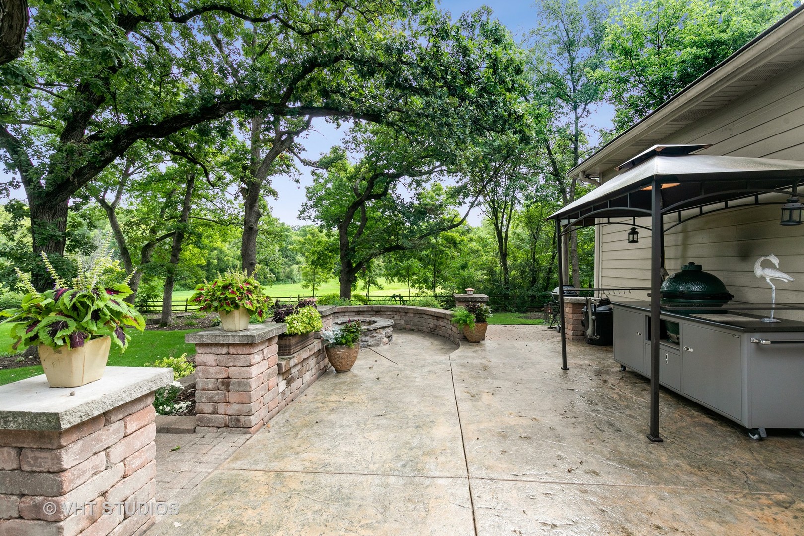 8902 Voss Road Marengo, IL 60152 - Photo 25 of 35 a view of a patio with table and chairs potted plants and large tree