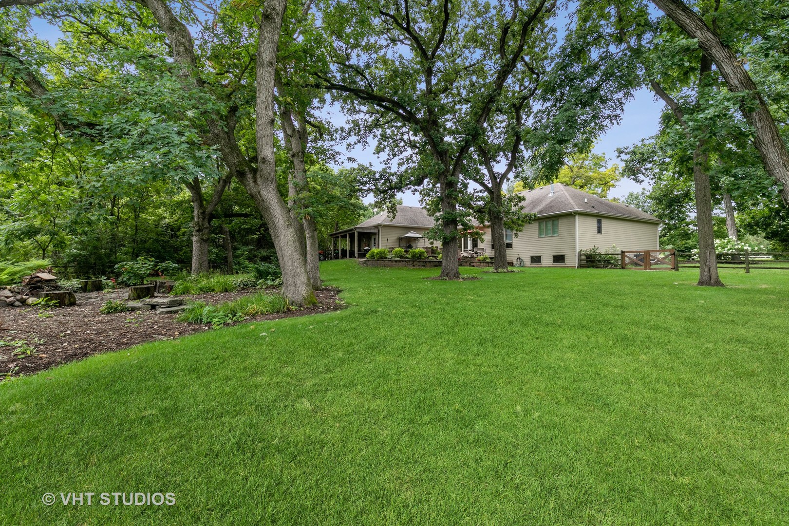 8902 Voss Road Marengo, IL 60152 - Photo 28 of 35 a view of a house with a big yard and large trees
