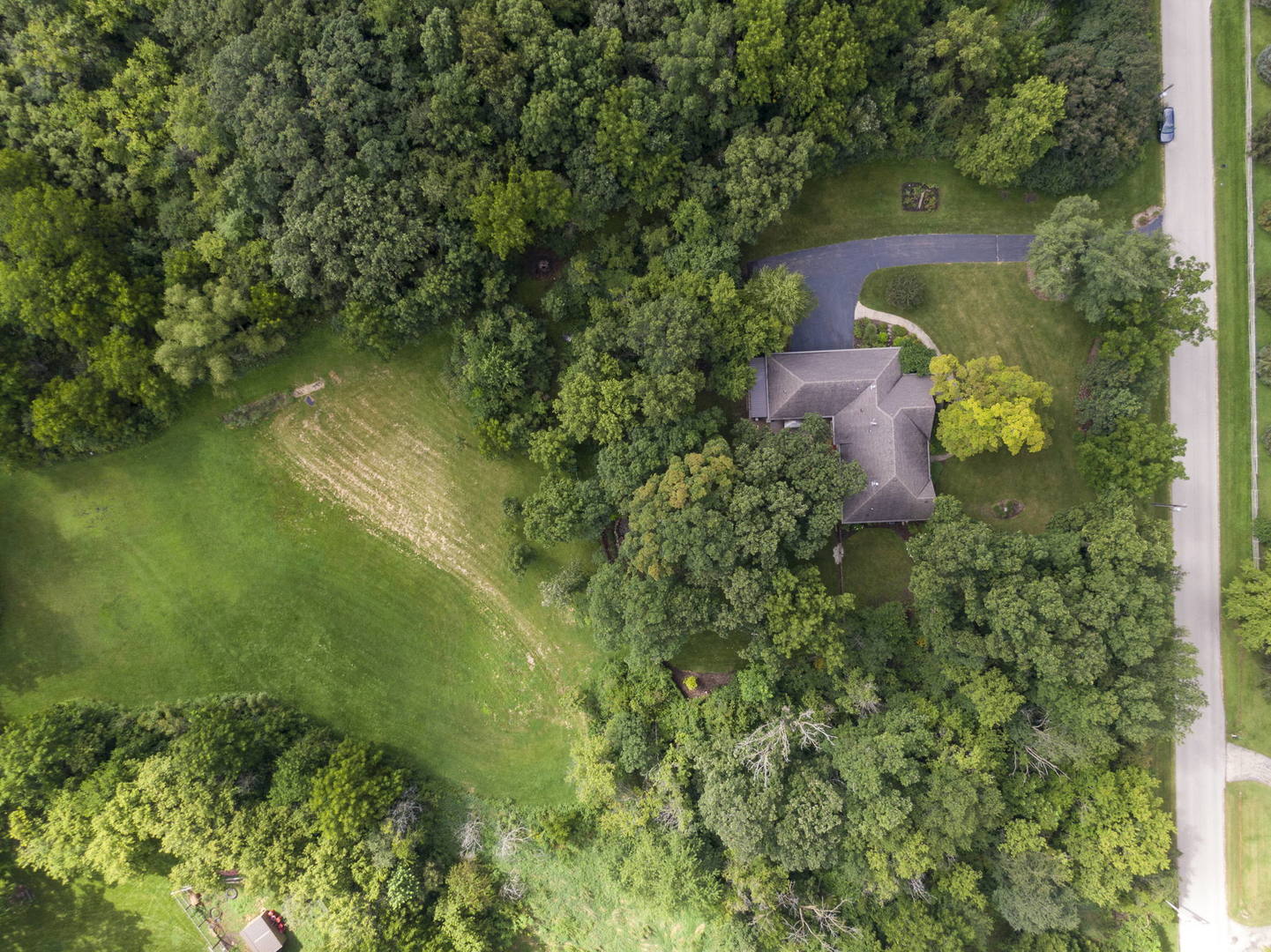 8902 Voss Road Marengo, IL 60152 - Photo 34 of 35 an aerial view of residential house with outdoor space and trees all around