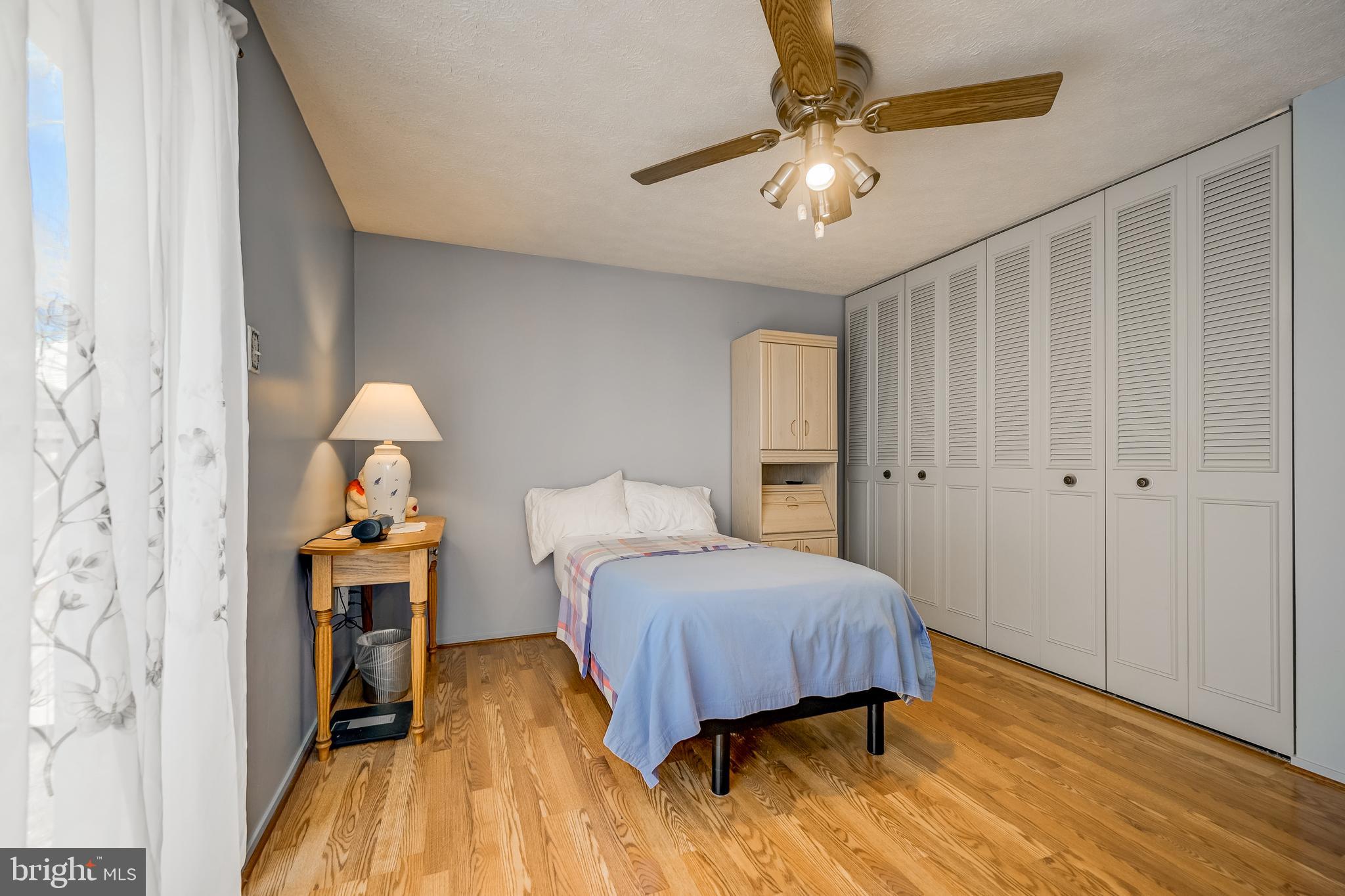 7179 Harp String Columbia, MD 21045 - Photo 13 of 27 a bedroom with a bed and a chandelier