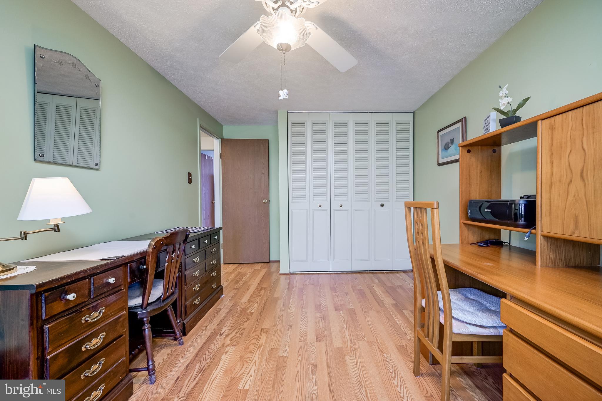 7179 Harp String Columbia, MD 21045 - Photo 17 of 27 a bedroom with a bed and a desk