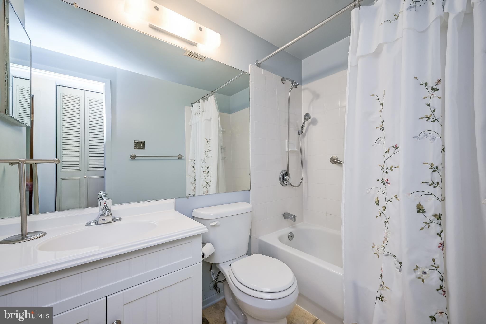 7179 Harp String Columbia, MD 21045 - Photo 18 of 27 a bathroom with a sink toilet vanity and shower