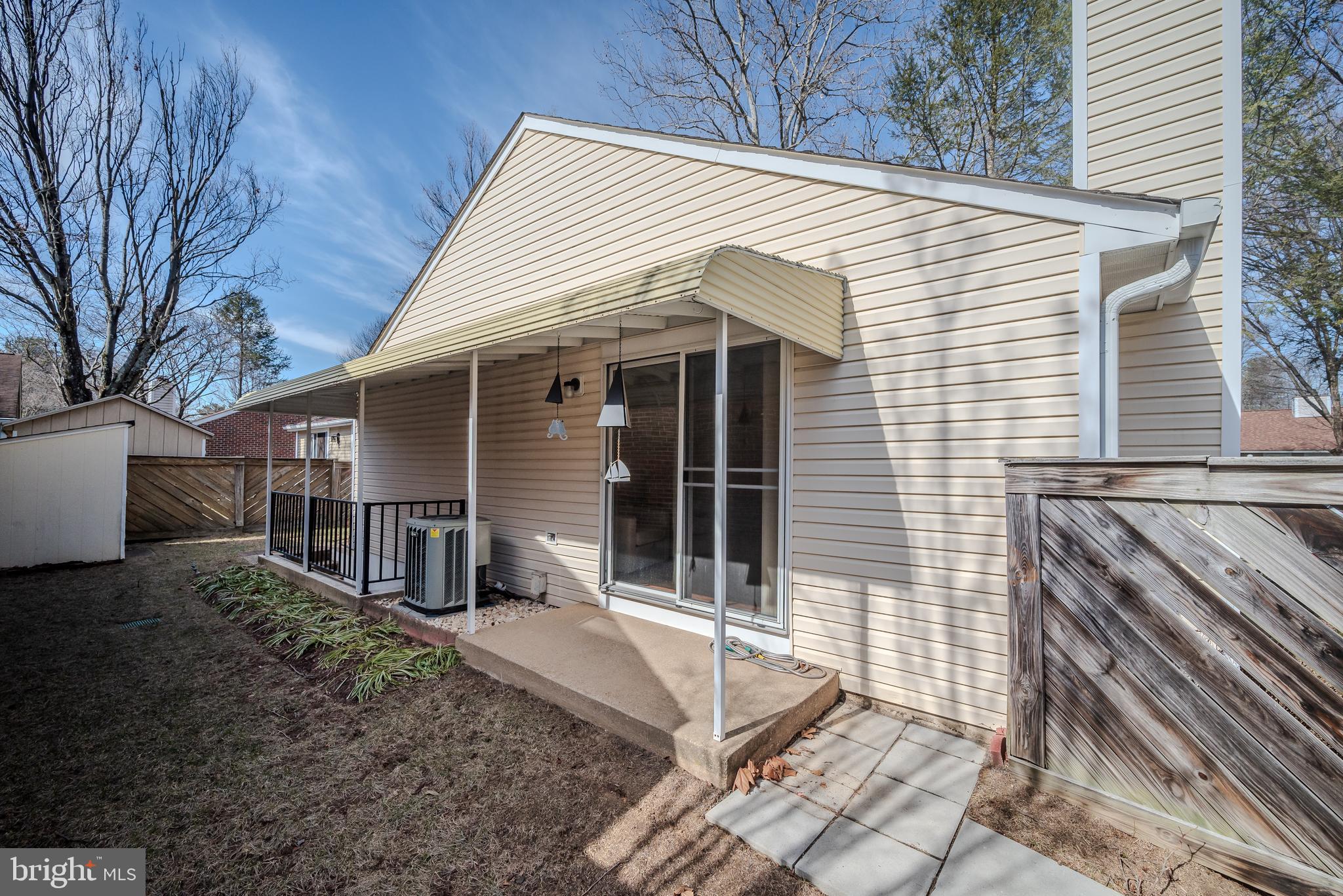 7179 Harp String Columbia, MD 21045 - Photo 23 of 27 a view of a house with backyard and sitting area