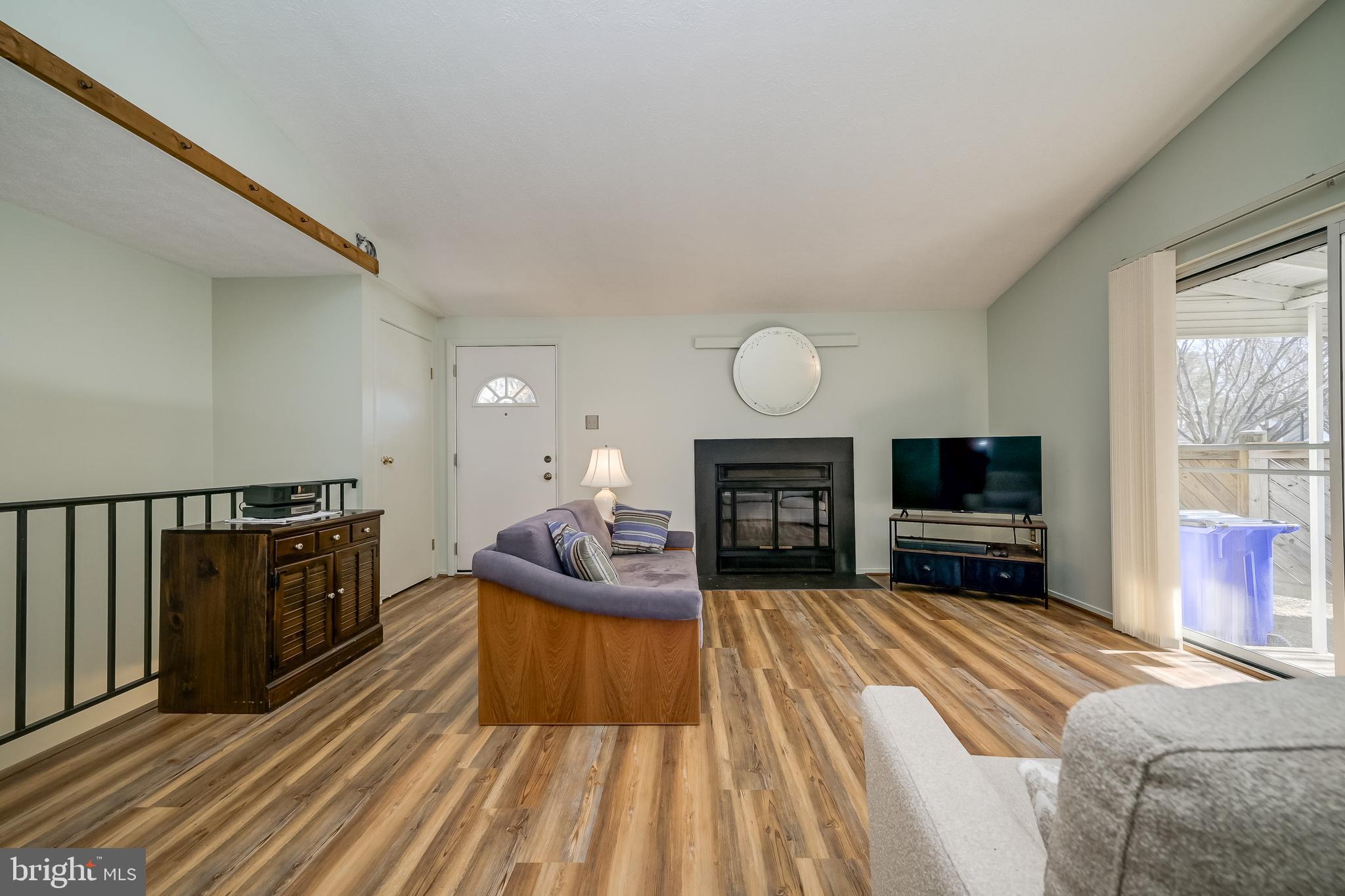 7179 Harp String Columbia, MD 21045 - Photo 6 of 27 a spacious bedroom with a bed and a flat screen tv