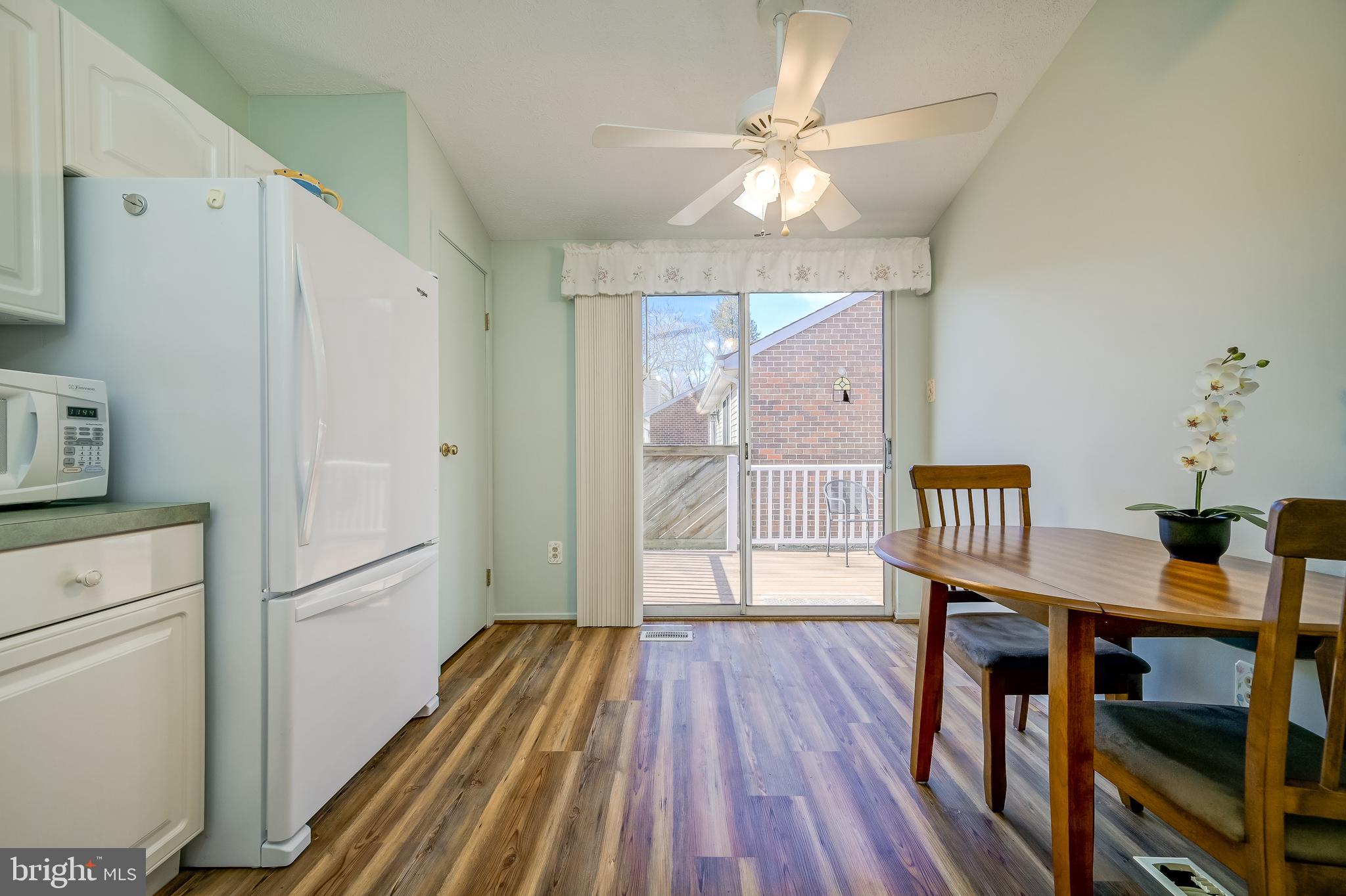 7179 Harp String Columbia, MD 21045 - Photo 9 of 27 a view of a hallway with wooden floor and entryway