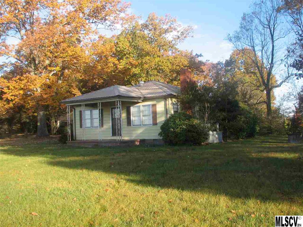 5792 Smith Road Vale, NC 28168 - Photo 1 of 14 a front view of a house with a garden