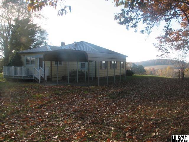 5792 Smith Road Vale, NC 28168 - Photo 12 of 14 a view of a house with a yard