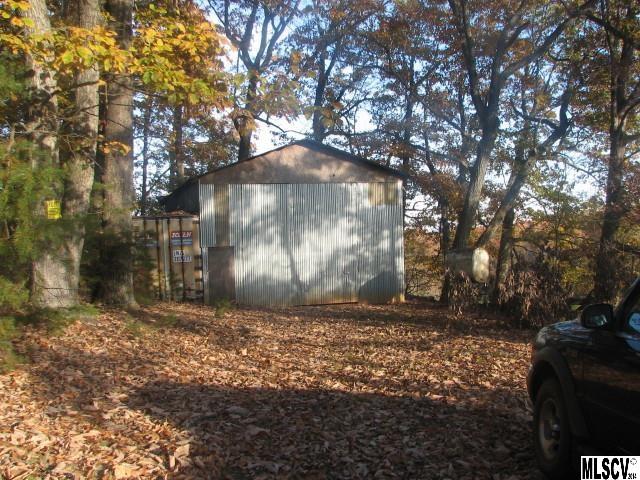 5792 Smith Road Vale, NC 28168 - Photo 13 of 14 a view of a yard with trees