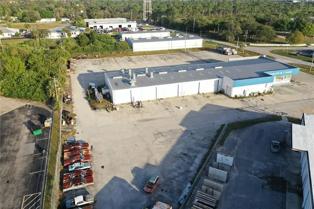 a view of a patio with a table and chairs