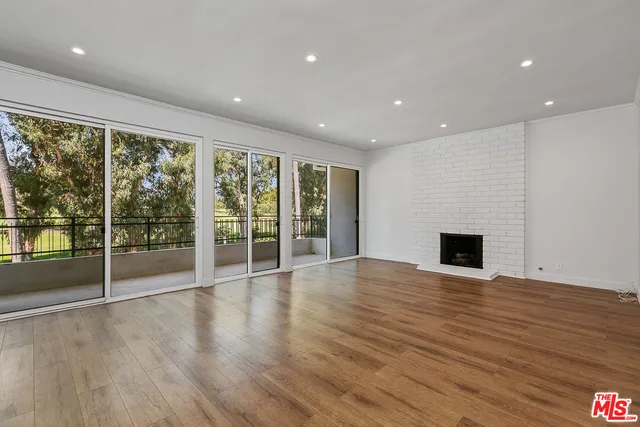 a white toilet sitting next to a white sink