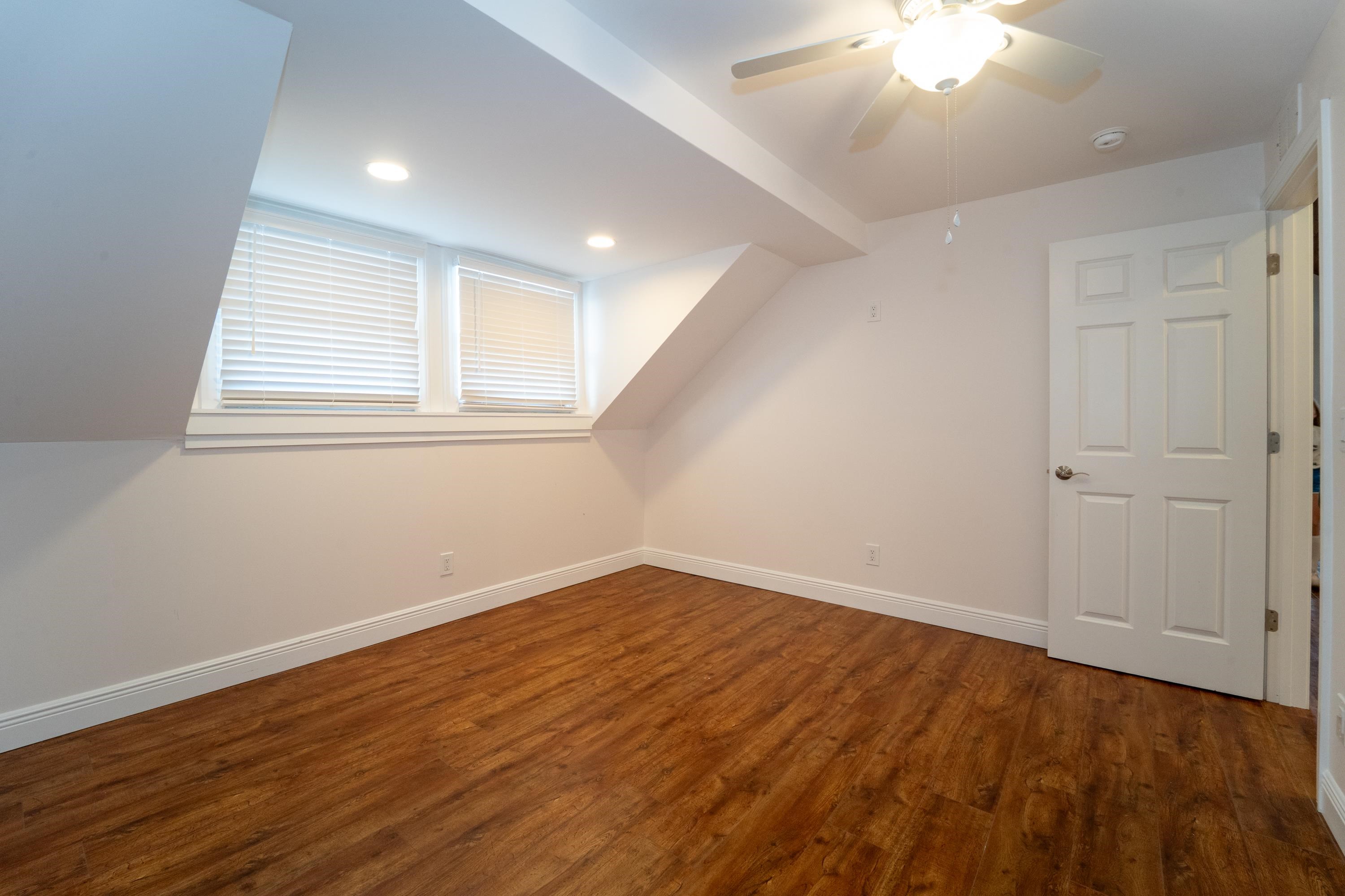 11 Aviles Street, Unit 3C St. Augustine, FL 32084 - Photo 14 of 24 Bonus room featuring dark wood-style floors, recessed lighting, and ceiling fan