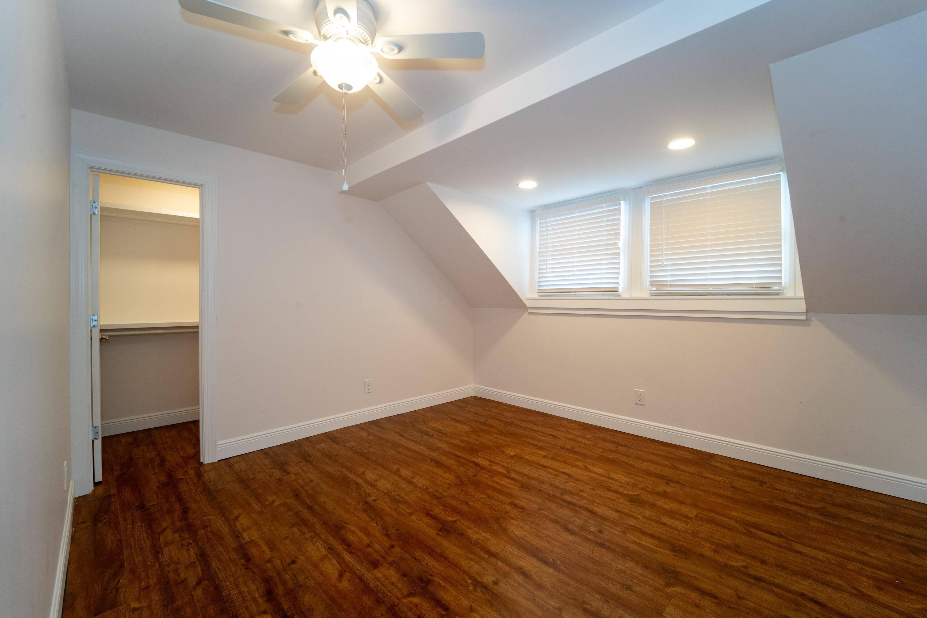 11 Aviles Street, Unit 3C St. Augustine, FL 32084 - Photo 15 of 24 Bonus room featuring dark wood finished floors, a ceiling fan, and recessed lighting