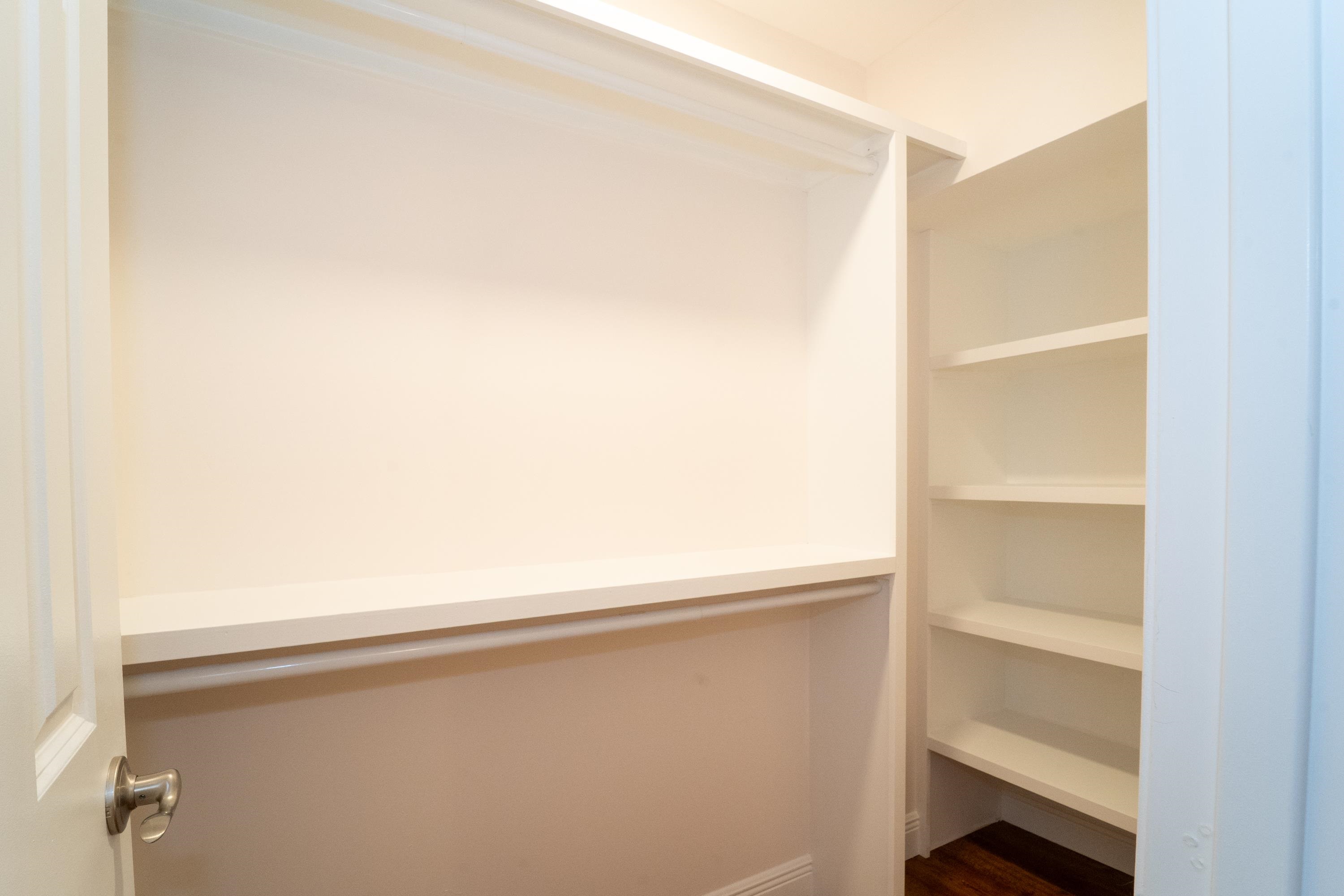 11 Aviles Street, Unit 3C St. Augustine, FL 32084 - Photo 17 of 24 Walk in closet featuring dark wood-style flooring