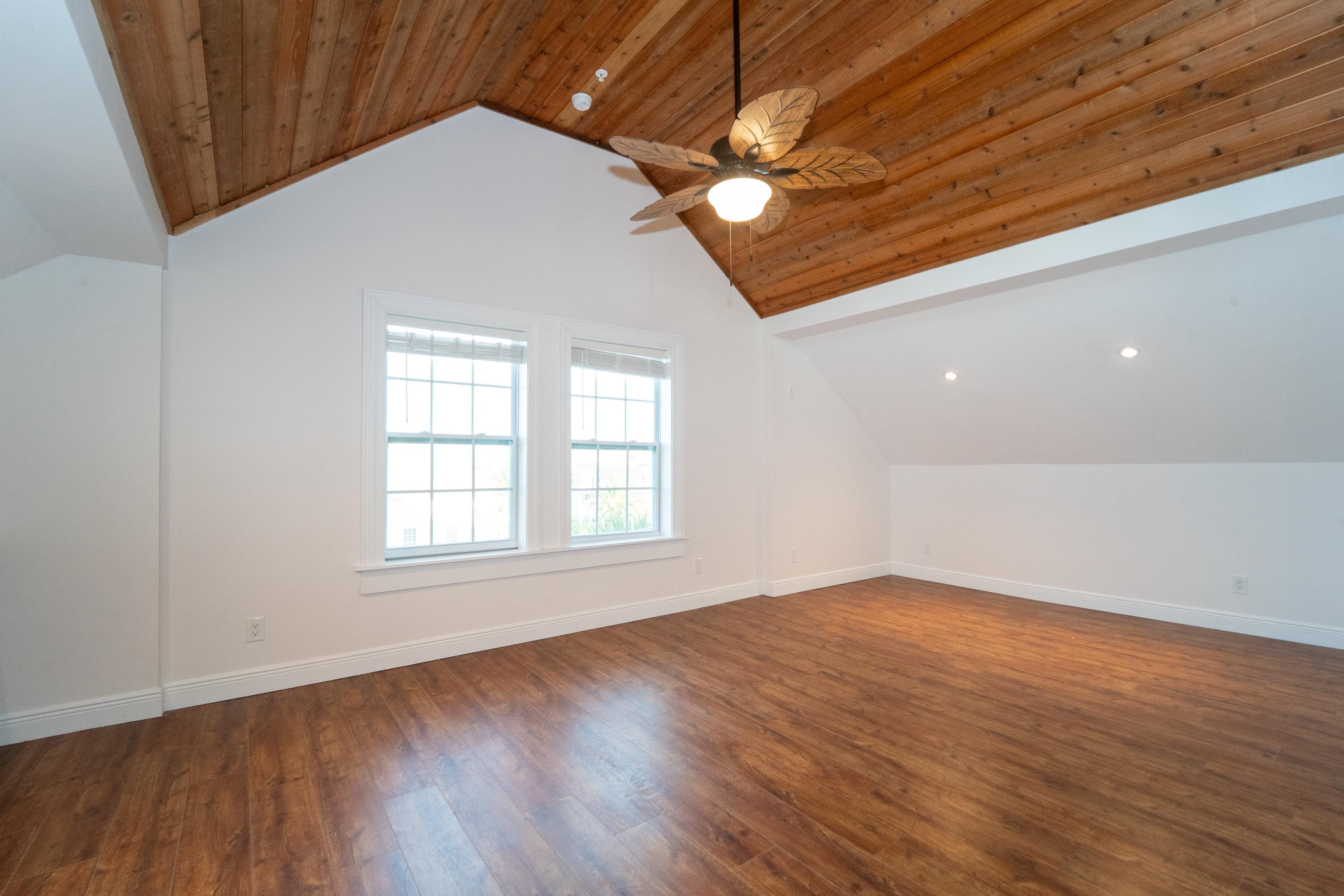 11 Aviles Street, Unit 3C St. Augustine, FL 32084 - Photo 2 of 24 Bonus room with lofted ceiling, dark wood-style flooring, recessed lighting, and ceiling fan