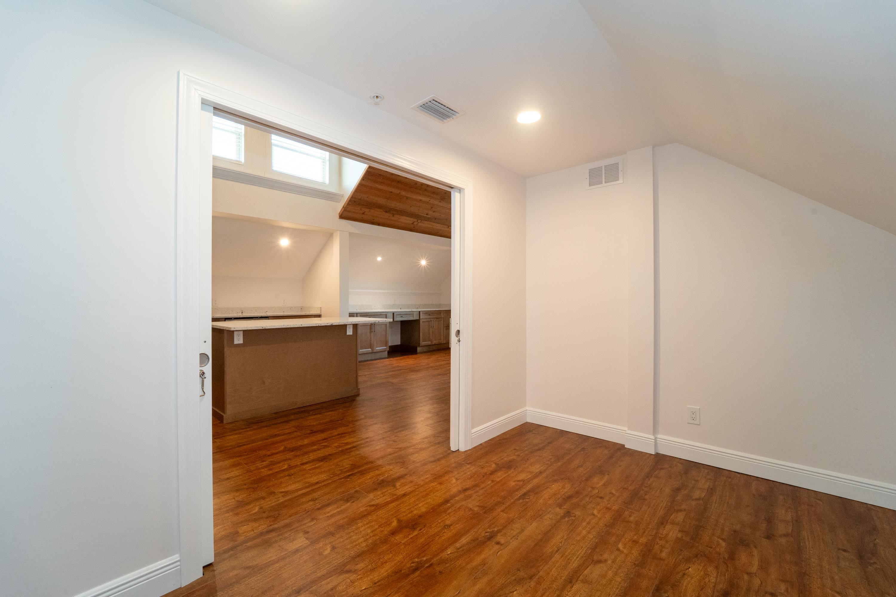 11 Aviles Street, Unit 3C St. Augustine, FL 32084 - Photo 19 of 24 Additional living space with dark wood finished floors, recessed lighting, and vaulted ceiling