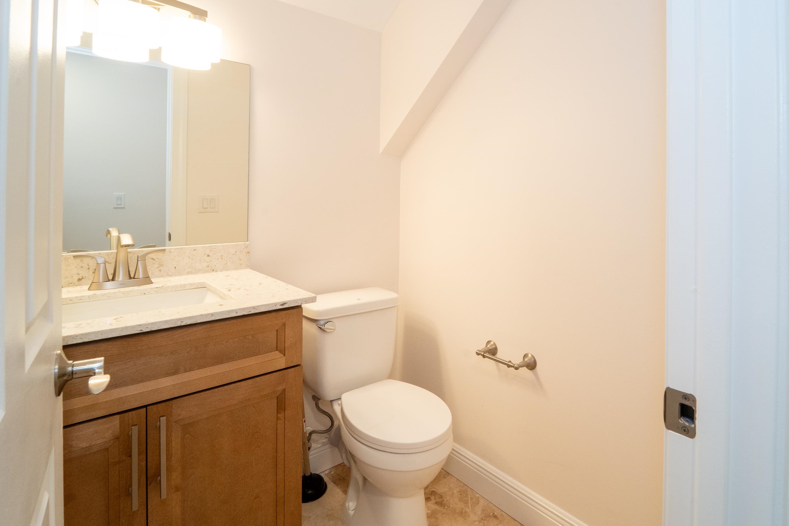 11 Aviles Street, Unit 3C St. Augustine, FL 32084 - Photo 21 of 24 Half bath with vanity and light tile patterned floors