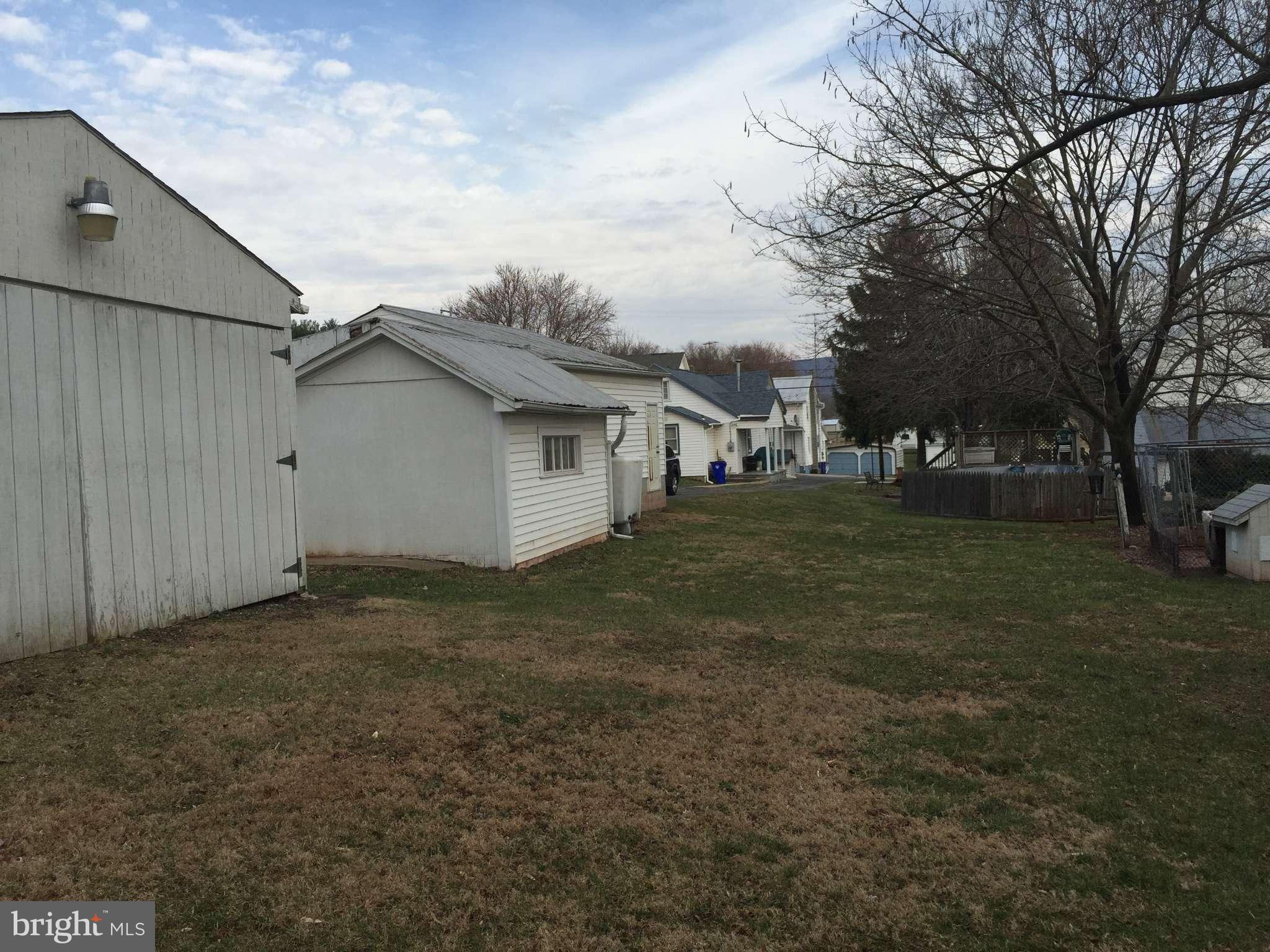 8215 Rocky Ridge Road Thurmont, MD 21788 - Photo 14 of 17 a view of a backyard with large trees