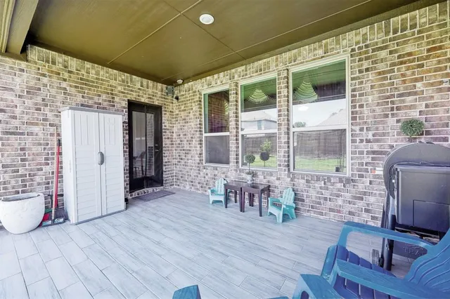 a view of a porch with seating space