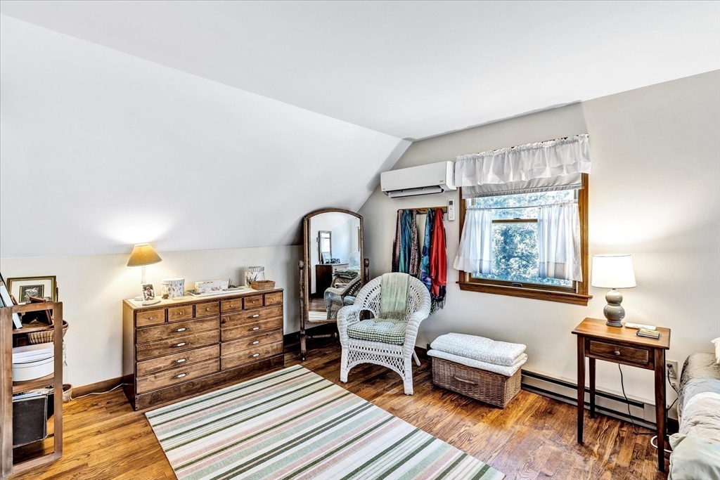 1 Carver Road Brewster, MA 02631 - Photo 12 of 33 a living room with furniture a rug and a window
