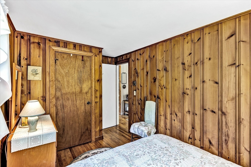 1 Carver Road Brewster, MA 02631 - Photo 17 of 33 a bedroom with a bed and a dresser